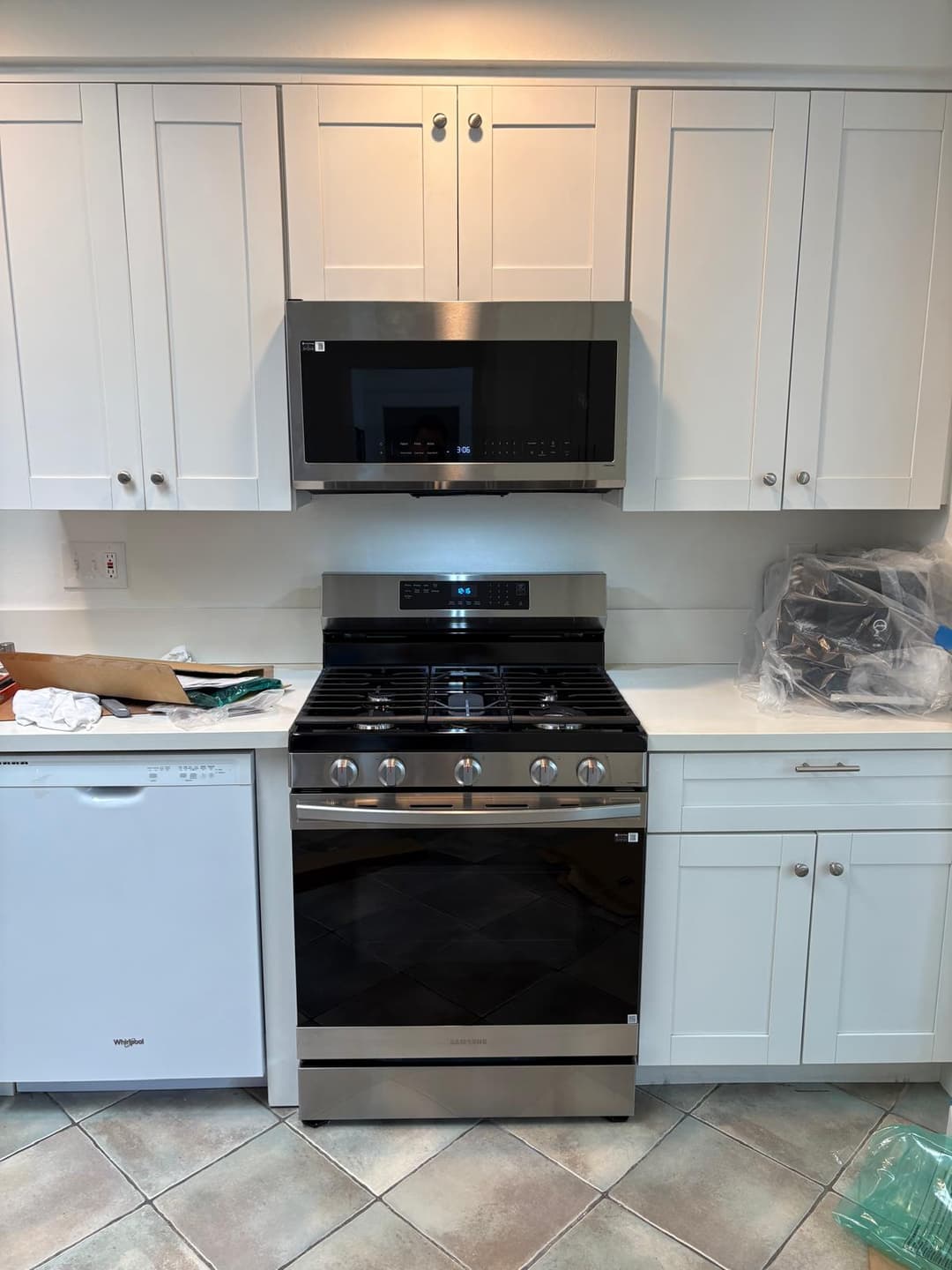 picture of  newly remodeled stove with stainless steel microwave